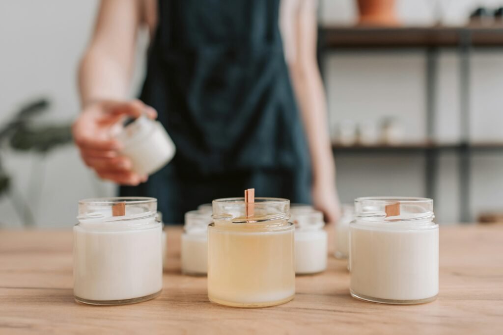 Freshly poured winter candles DIY cooling in minimalist glass containers