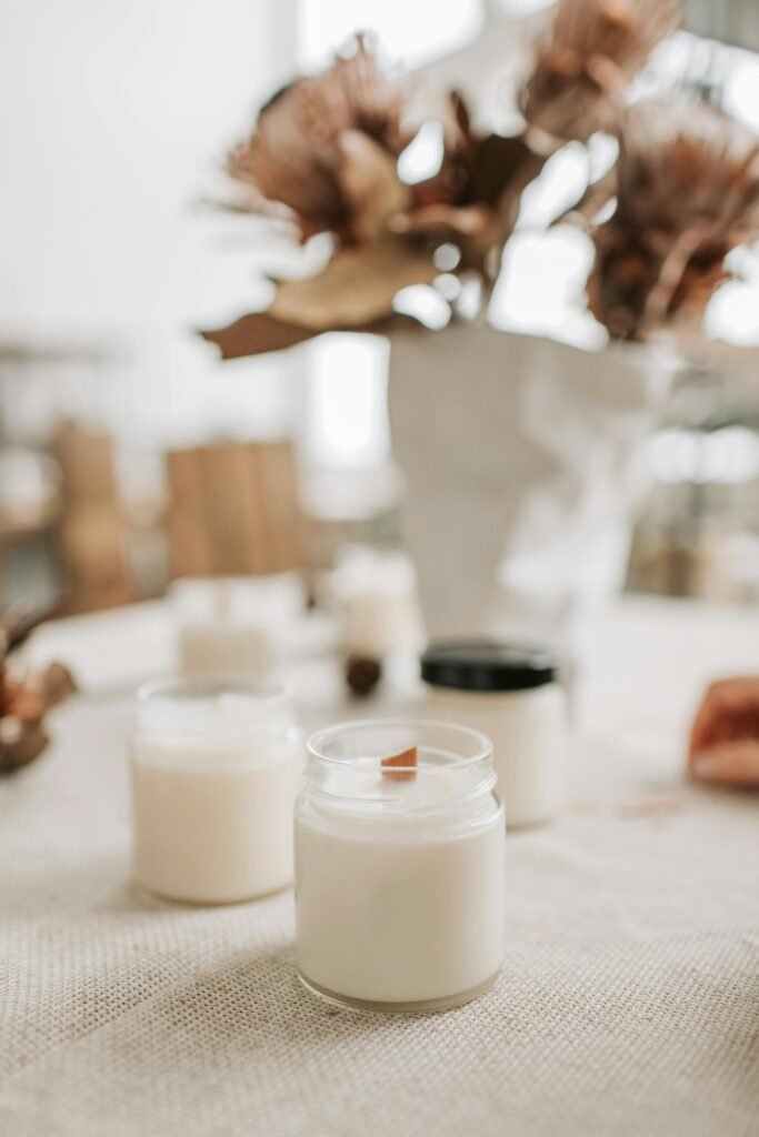 Homemade winter candles DIY styled on a table as cozy winter home decor